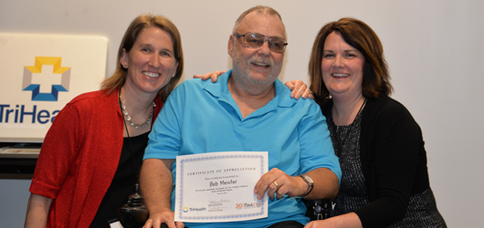 ThinkFirst volunteer Bob Meister, center, with Krista Jones, left, and Stephanie Lambers, right, of ThinkFirst and TriHealth.